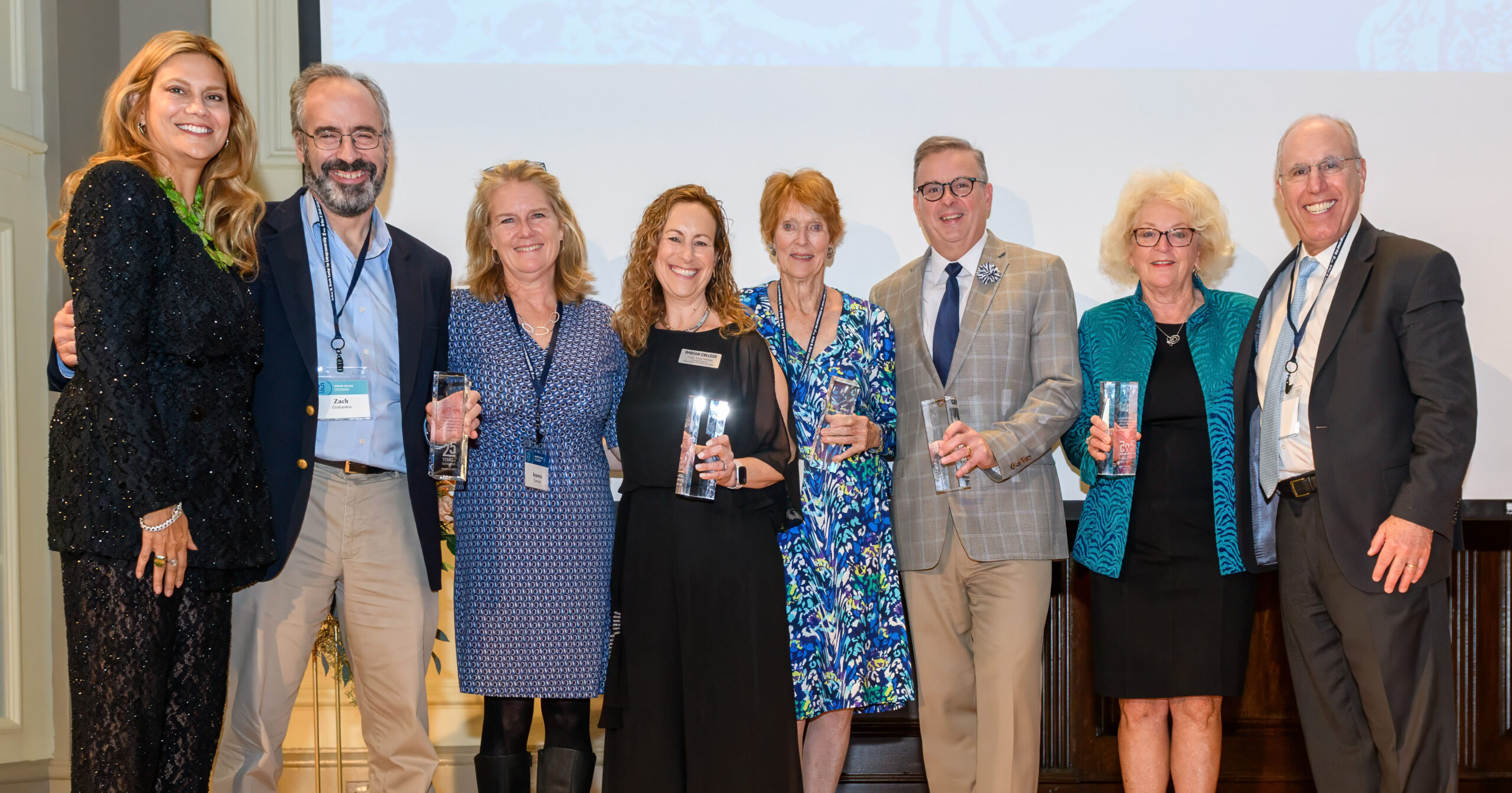 2023-10-25 Celebrating 25 Years at the Forefront of Entrepreneurship A group stands on stage holding awards