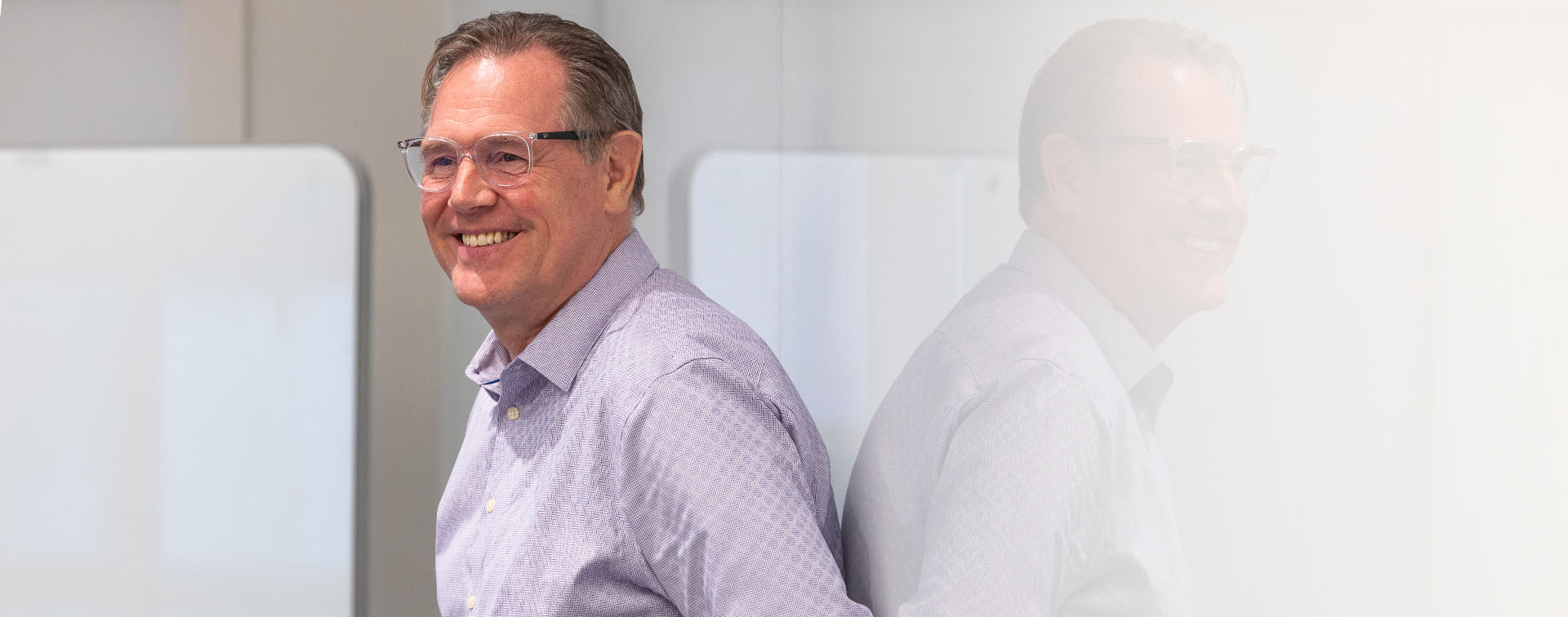 Professor in front of white board