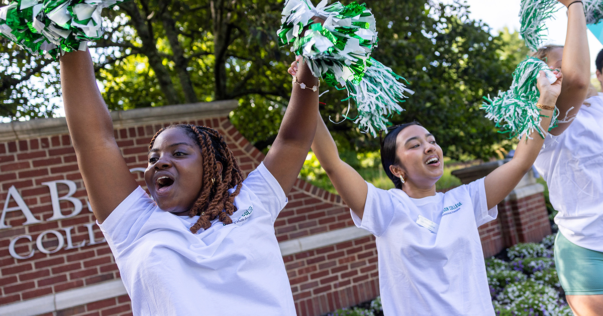 Students cheer in front of the gate