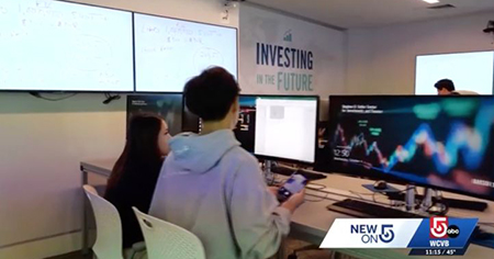 A still of students on a computer