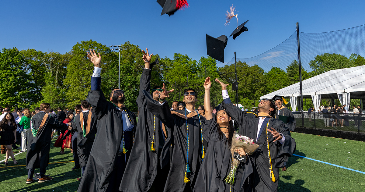 Grads throwing their caps