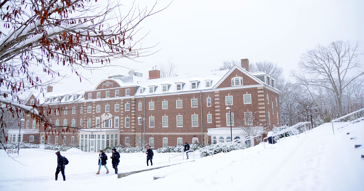Uwill Feature Students walking in the snow on campus